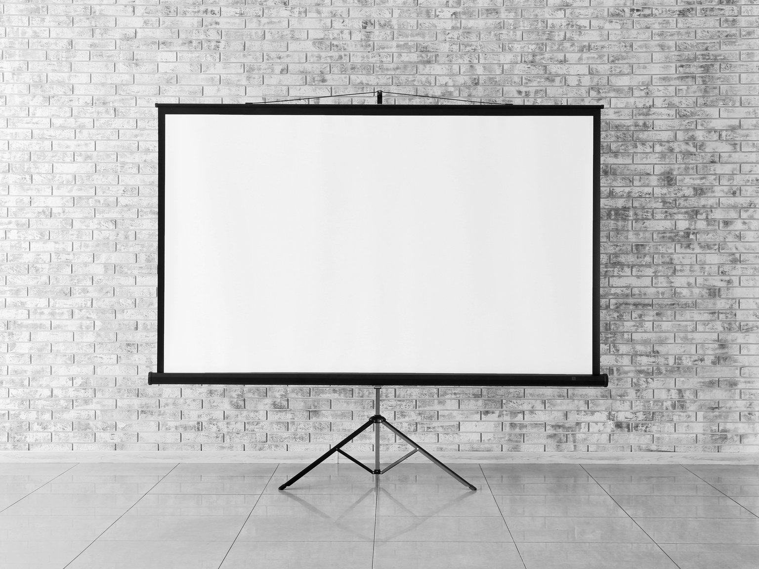 Projector Screen near Brick Wall Indoors